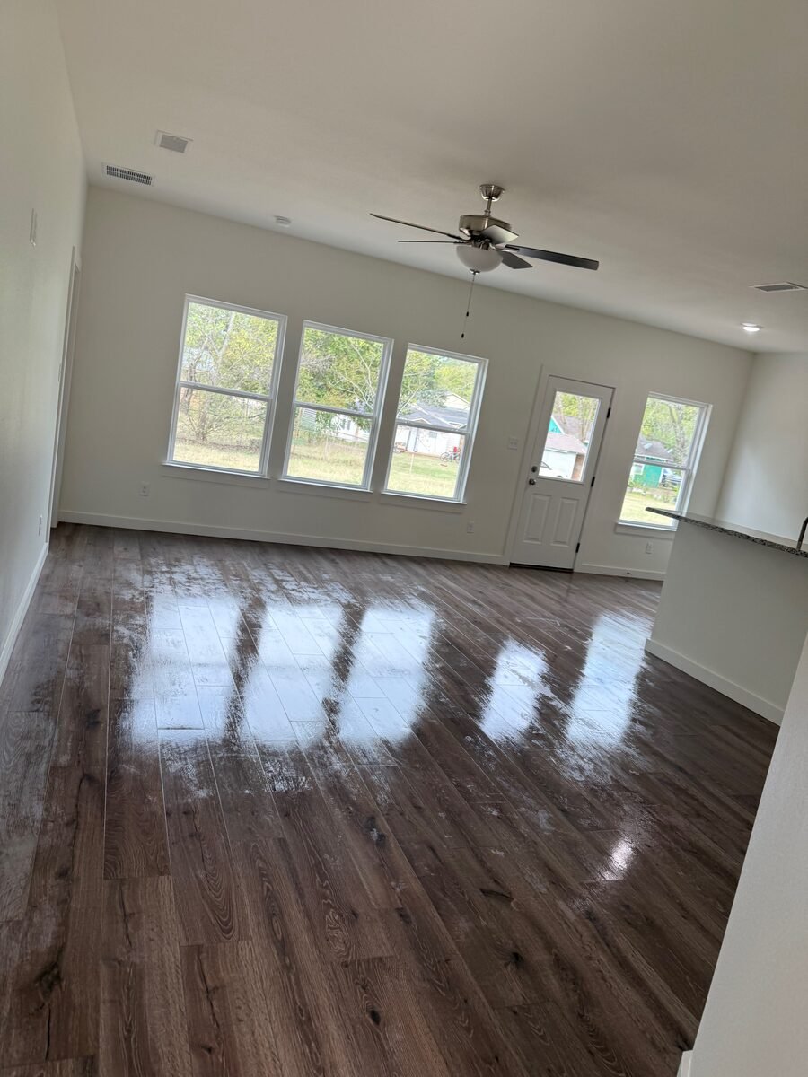 An open-plan main floor after a whole-home clean, every room covered